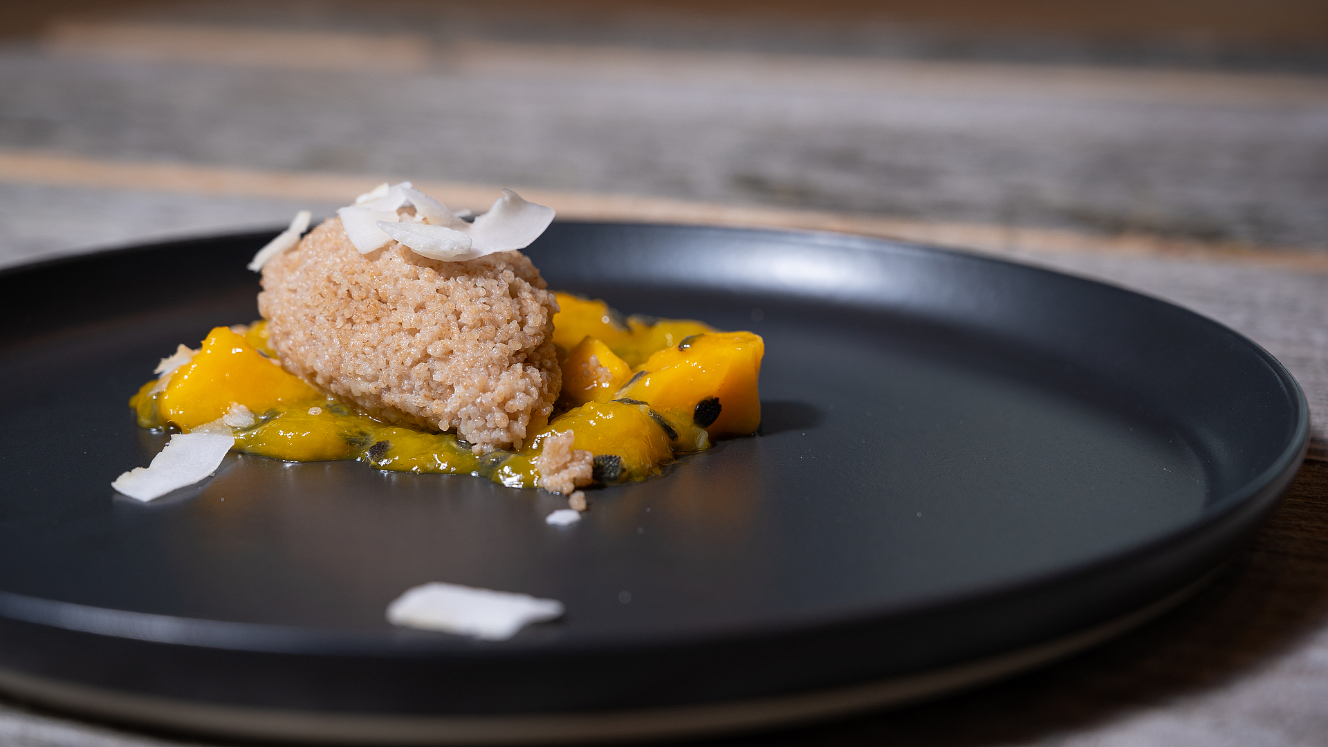 Coconut couscous with mango and passion fruit compote