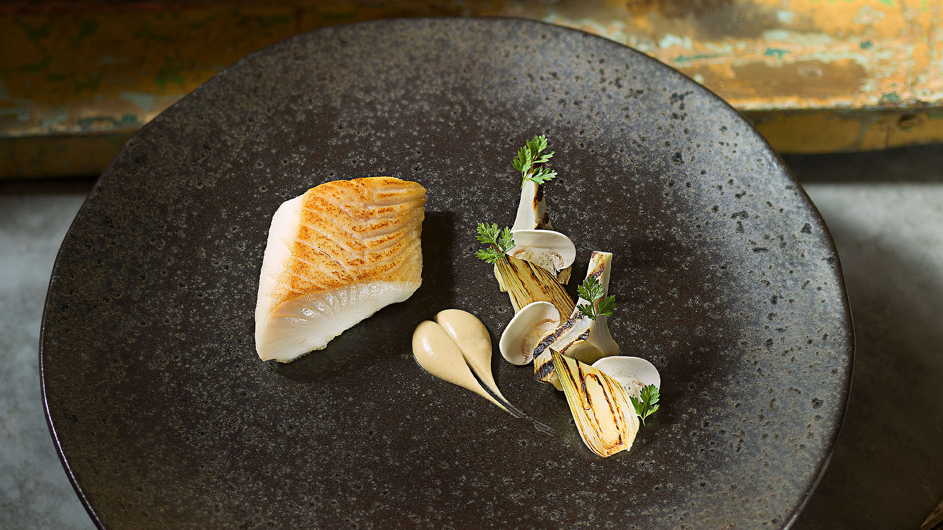 Black cod with artichokes and spring onions