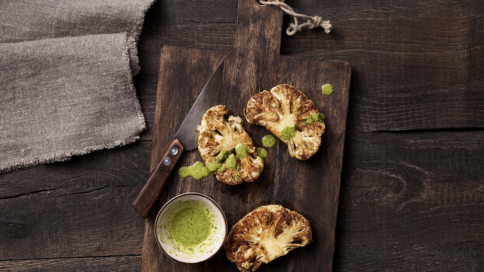 Spicy cauliflower steaks with herb sauce