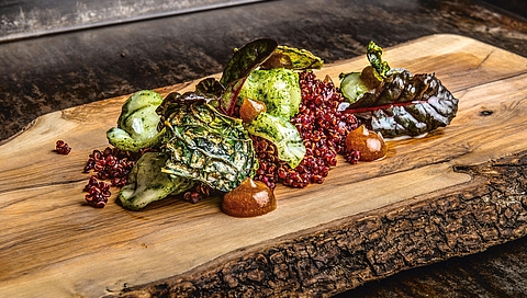 Braised Brussels sprouts with date cream, quinoa and beetroot juice