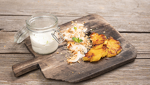 Grilled spiced pineapple with coconut crisps and coconut & lime yogurt