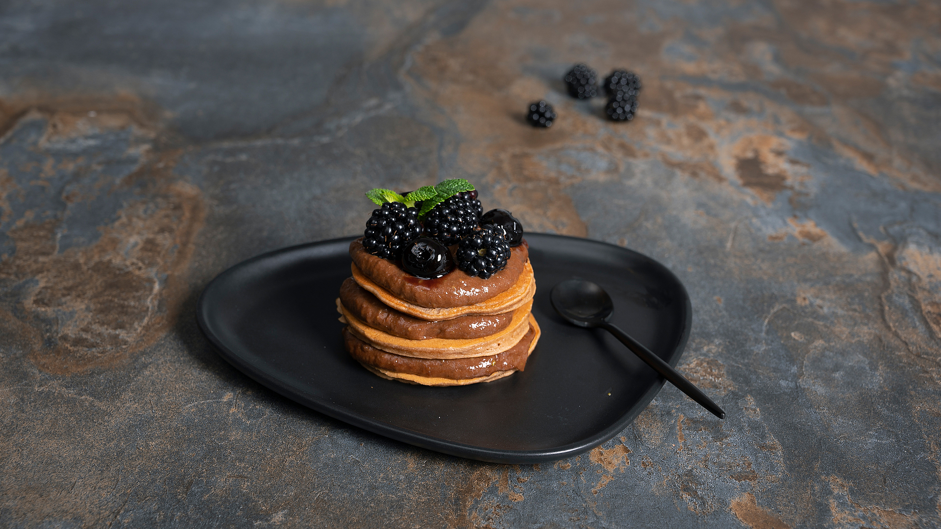 Chestnut pancake tower with chocolate cream and fruit