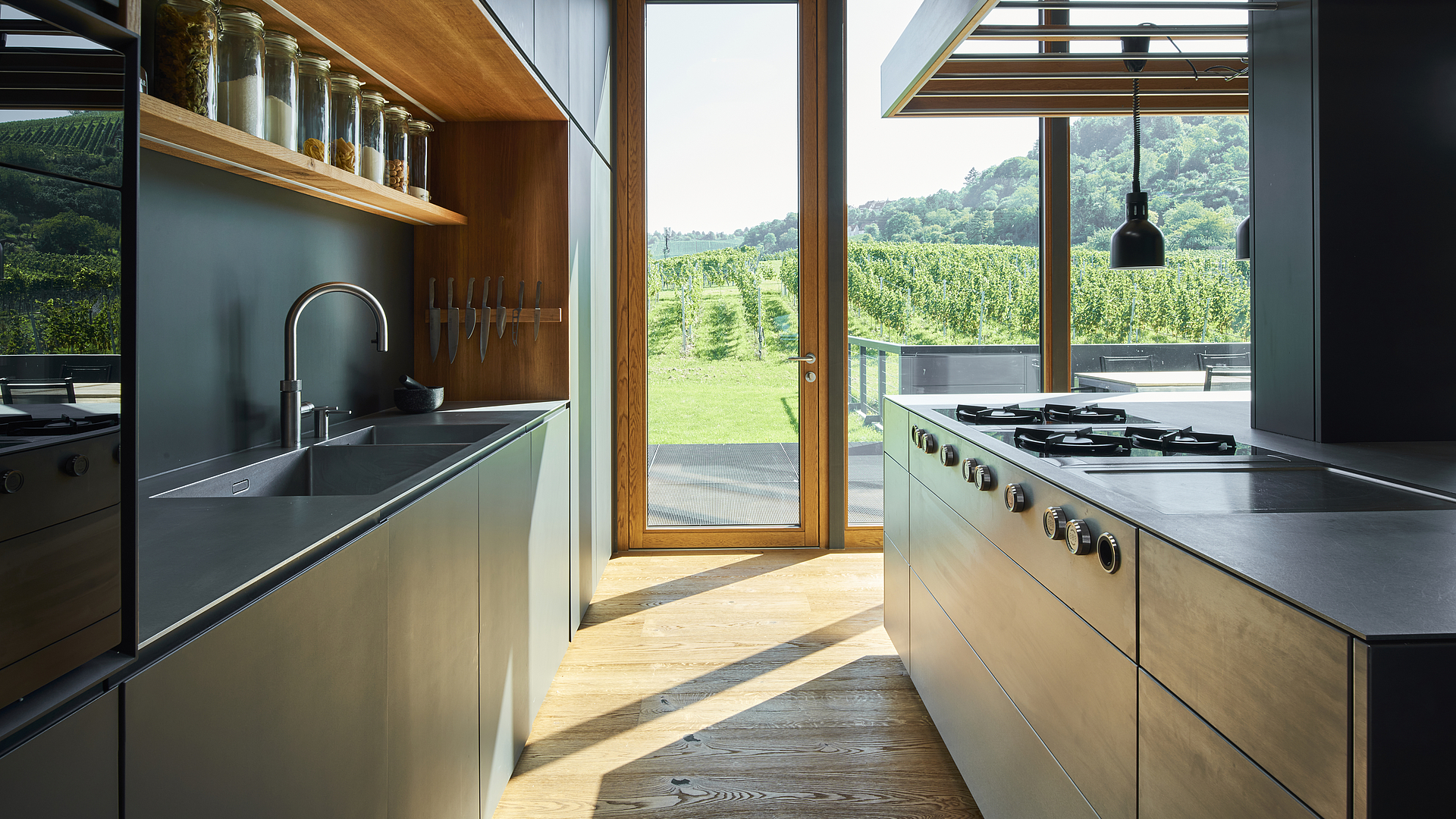 A modern stainless-steel kitchen in the middle of the vineyards 