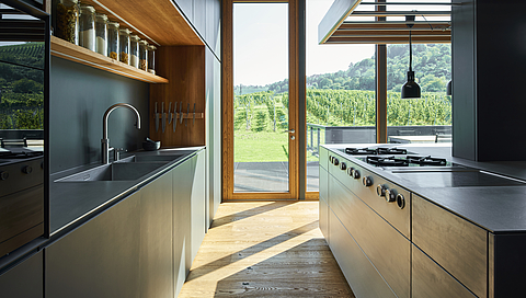 A modern stainless-steel kitchen in the middle of the vineyards 