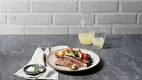 Beef steaks with grilled vegetables