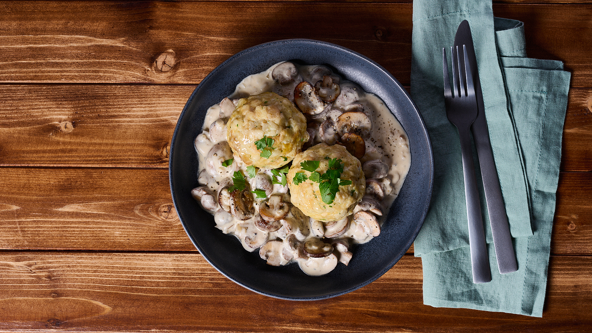 Bread dumplings in a light creamy mushroom sauce