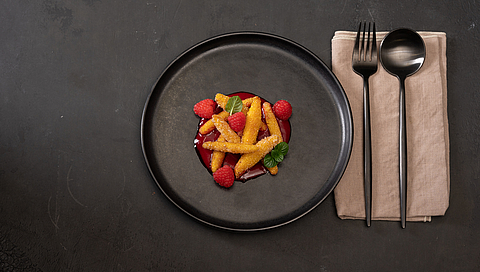 Sweet cornmeal dumplings with a fruit coulis