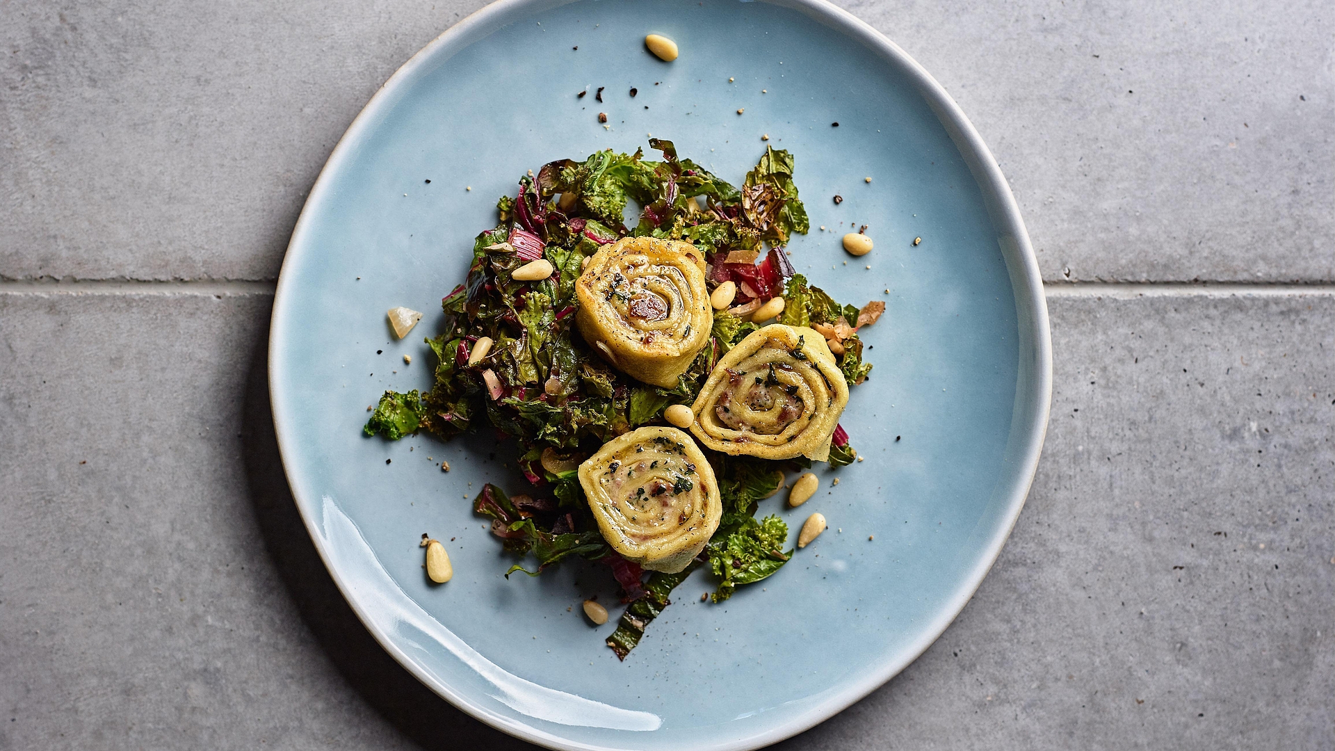 Maultaschen on a bed of chard and kale