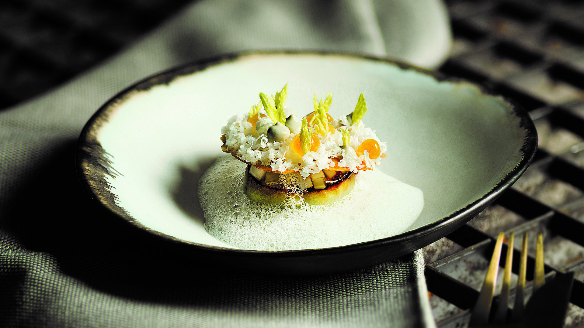 Fried aubergine slices with celery salad and coconut foam 