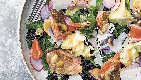 Pan-fried salmon and warm kale Caesar salad