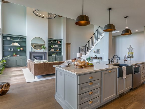 Moderne Wohnküche mit BORA Kochfeldabzug auf Kücheninsel und elegantem, offenem Wohnbereich.